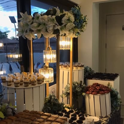 Dessert shooters and pastries staged by a sunlit window